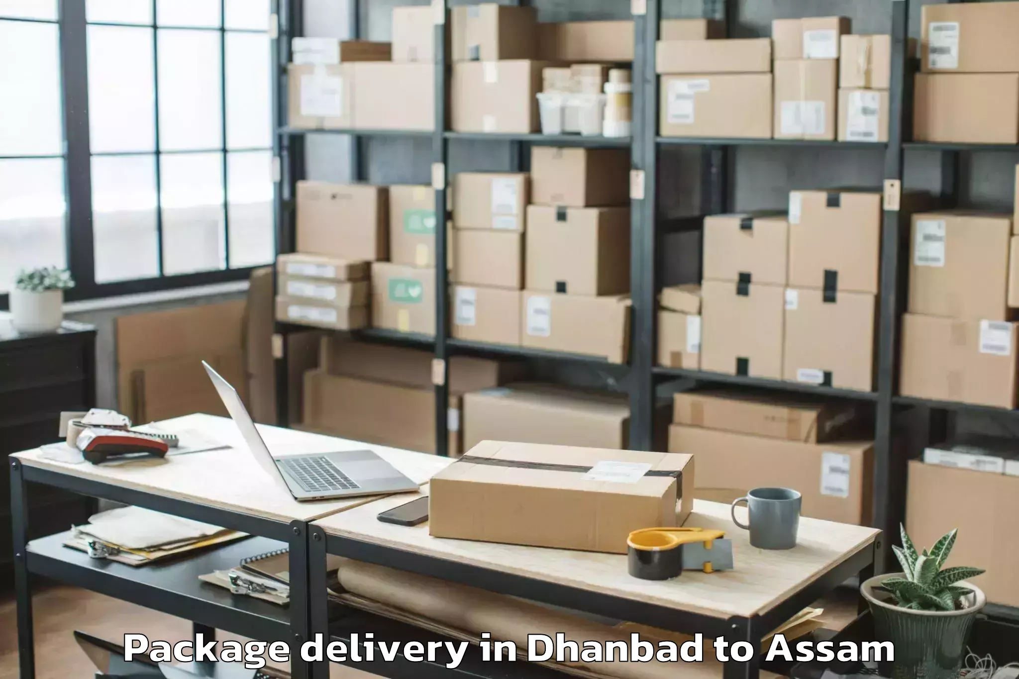 Trusted Dhanbad to Chapar Package Delivery